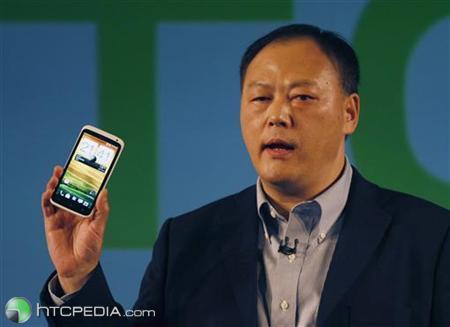 HTC's President and CEO Chou poses with new HTC One during news conference at Mobile World Congress in Barcelona